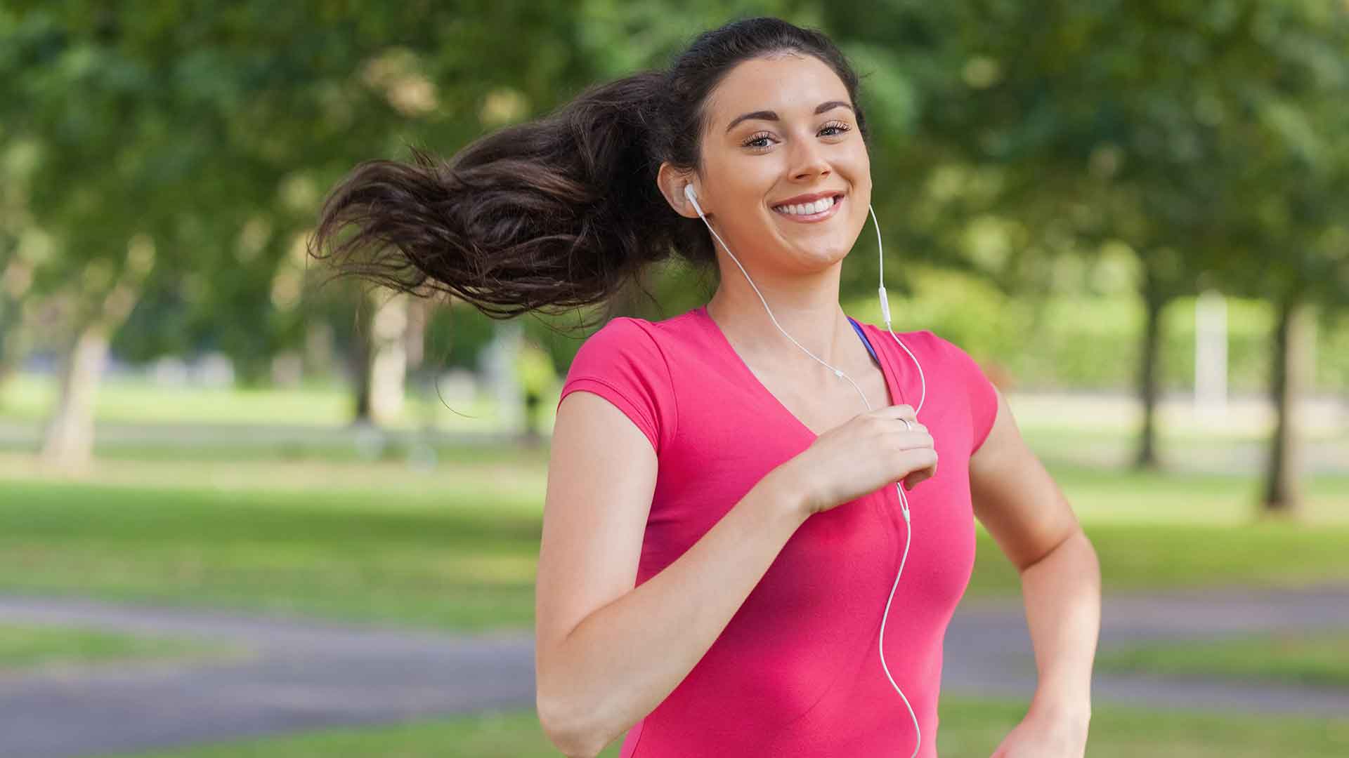 a woman running in a park